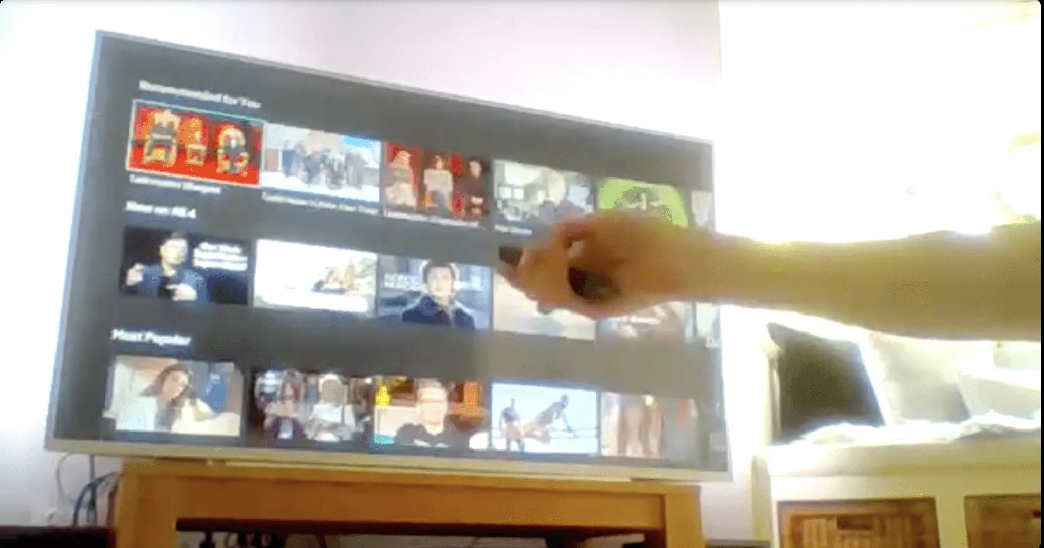A participant's TV filmed through their laptop during a remote session